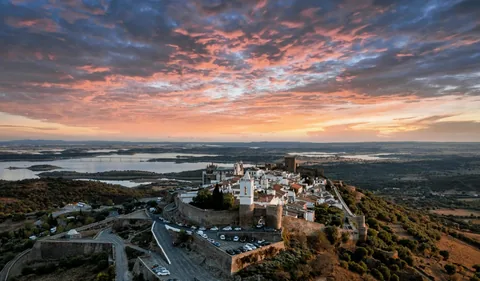 Hilltop village overlooking the Alentejo landscape at sunset